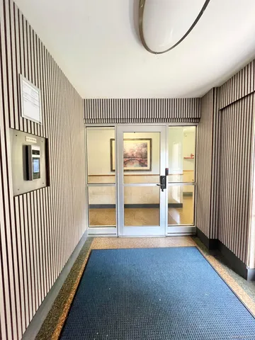 a front view of a house with large windows