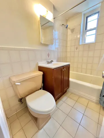 a bathroom with a sink a toilet and bathtub