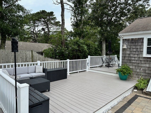 2 Ebb Road Dennis, MA 02660 - Photo 3 of 19 a view of a deck with couches and wooden floor