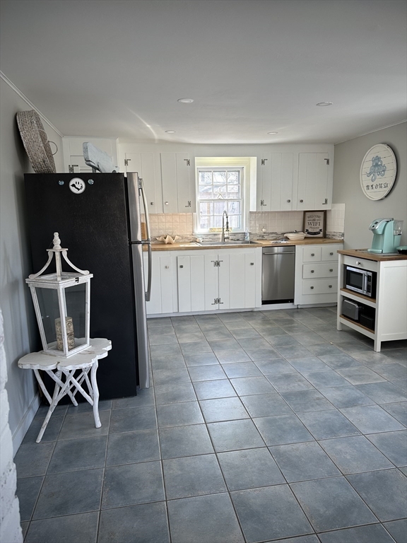 2 Ebb Road Dennis, MA 02660 - Photo 9 of 19 a kitchen with a sink appliances and cabinets