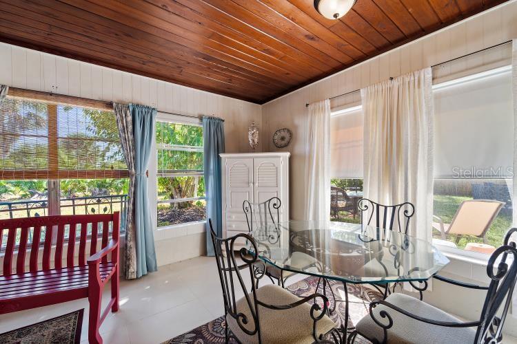 444 Driftwood Road Venice, FL 34293 - Photo 15 of 27 a view of a dining room with furniture window and outside view