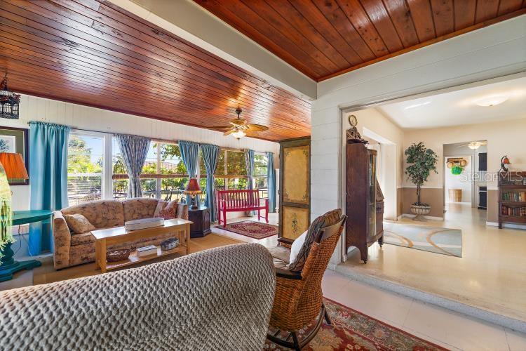 444 Driftwood Road Venice, FL 34293 - Photo 16 of 27 a living room with furniture and a table