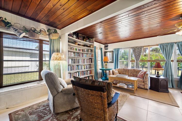 444 Driftwood Road Venice, FL 34293 - Photo 17 of 27 a living room with furniture and a large window