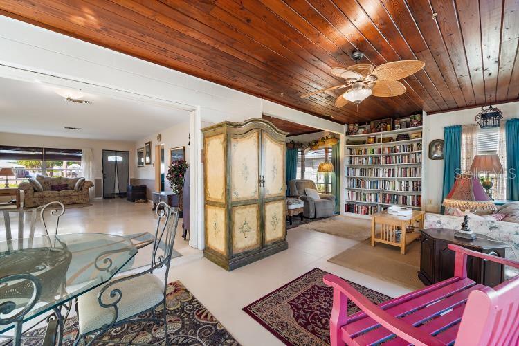 444 Driftwood Road Venice, FL 34293 - Photo 18 of 27 a living room with furniture and a chandelier