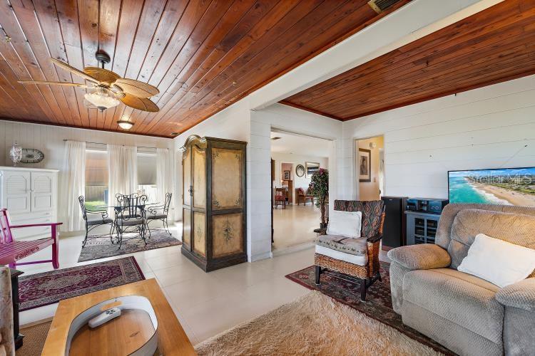 444 Driftwood Road Venice, FL 34293 - Photo 19 of 27 a living room with furniture and a fireplace