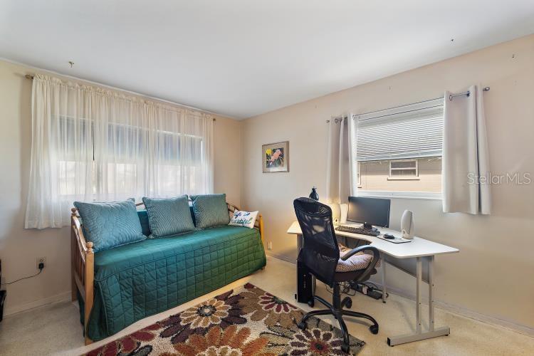 444 Driftwood Road Venice, FL 34293 - Photo 20 of 27 a living room with furniture and a window