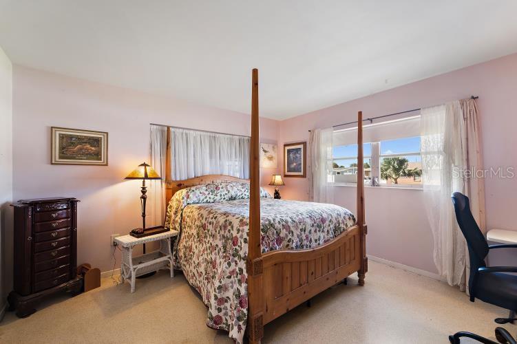 444 Driftwood Road Venice, FL 34293 - Photo 25 of 27 a bed room with furniture and a window