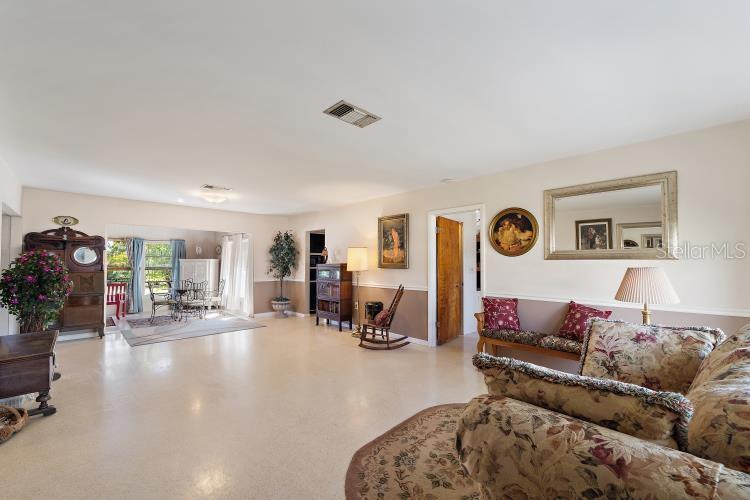 444 Driftwood Road Venice, FL 34293 - Photo 8 of 27 a living room with furniture and wooden floor
