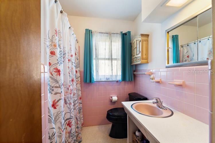 444 Driftwood Road Venice, FL 34293 - Photo 10 of 27 a bathroom with a sink a toilet and a sink