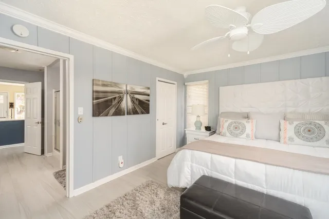 a bedroom with a bed and a couch