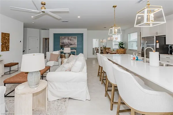 a large kitchen with a table and chairs