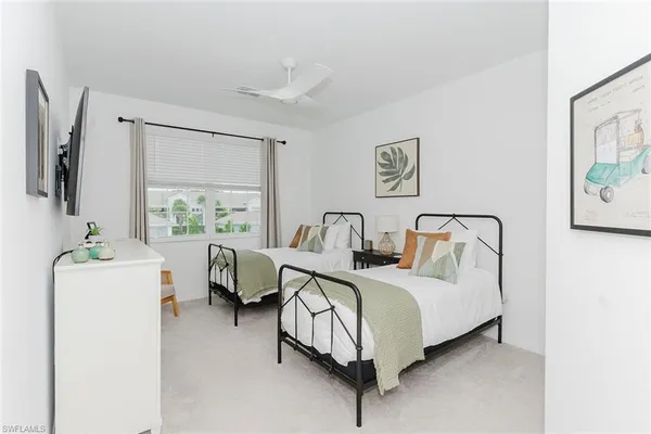 a spacious bedroom with a bed and a couch