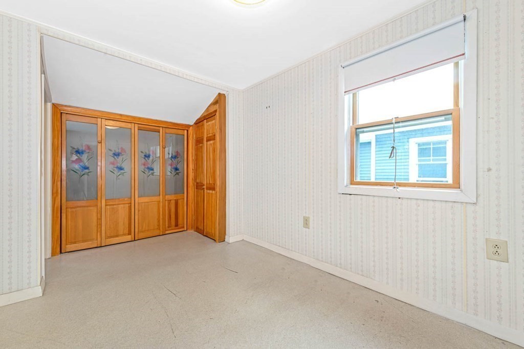 101 Reed Street Cambridge, MA 02140 - Photo 11 of 15 a view of an empty room with a window