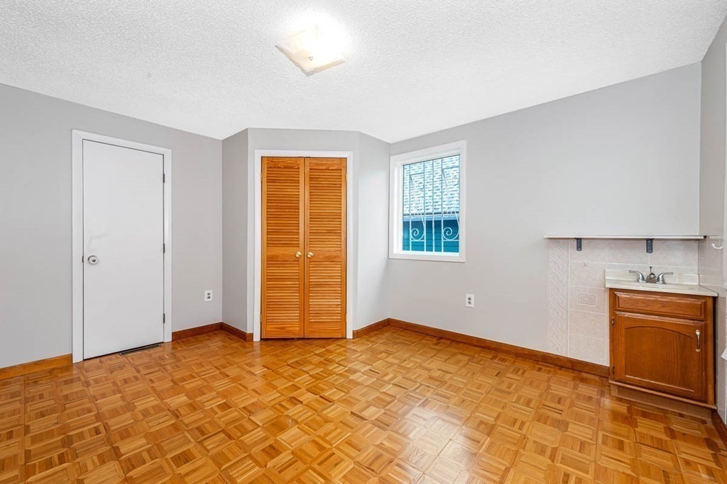 101 Reed Street Cambridge, MA 02140 - Photo 13 of 15 a view of an empty room with a window