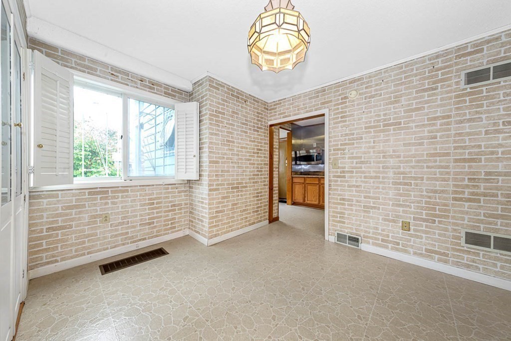 101 Reed Street Cambridge, MA 02140 - Photo 6 of 15 a view of an empty room with a window