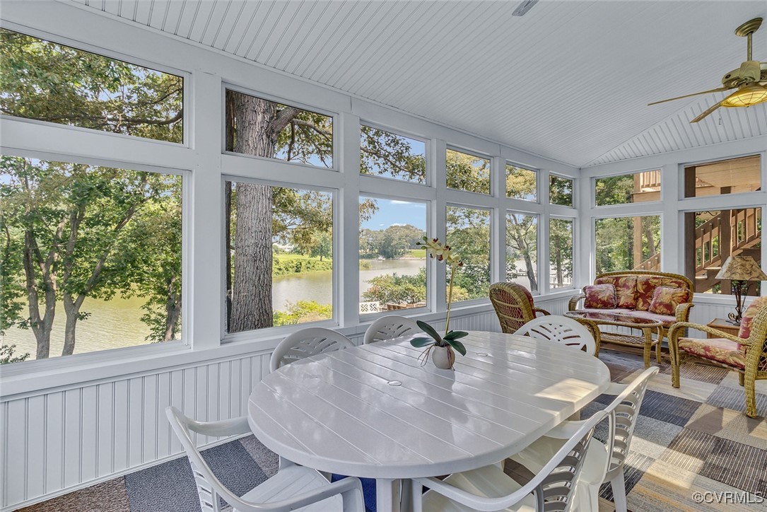 781 Coan Haven Road Lottsburg, VA 22511 - Photo 13 of 50 a view of a dining room with furniture large windows and wooden floor
