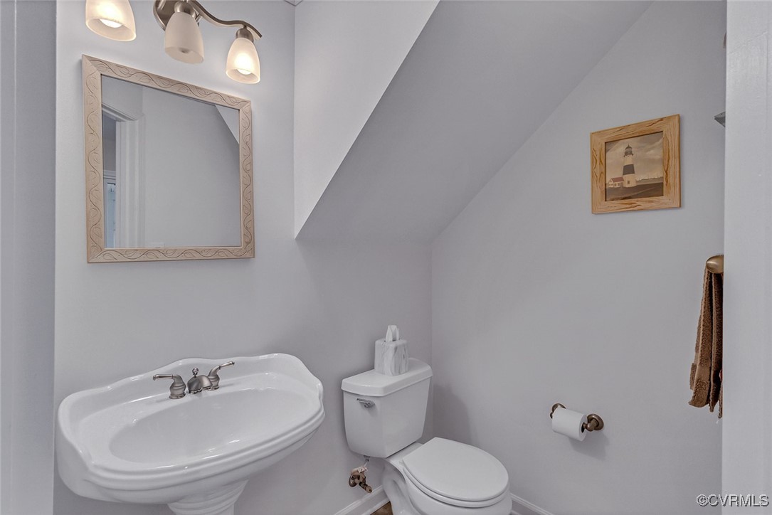 781 Coan Haven Road Lottsburg, VA 22511 - Photo 15 of 50 a bathroom with a sink mirror and toilet