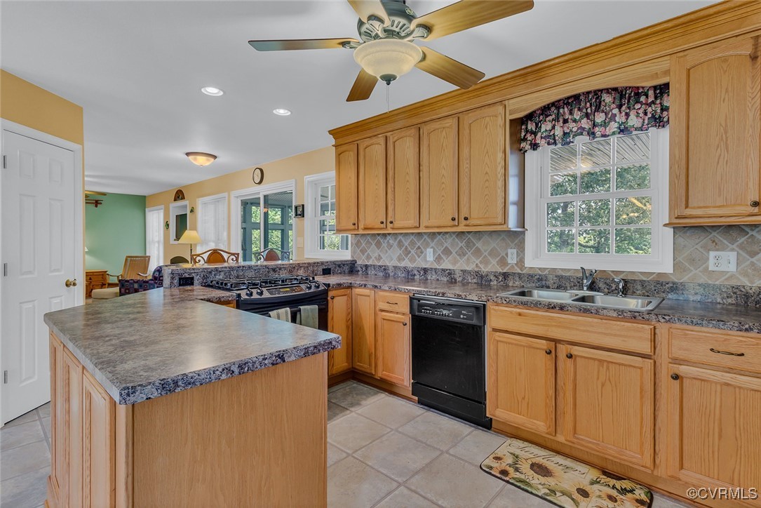 781 Coan Haven Road Lottsburg, VA 22511 - Photo 18 of 50 a kitchen with granite countertop a sink and cabinets