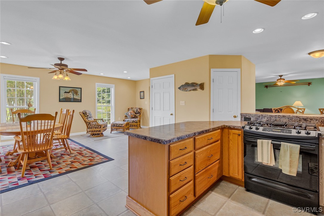 781 Coan Haven Road Lottsburg, VA 22511 - Photo 19 of 50 a kitchen with stainless steel appliances granite countertop a stove a sink and a refrigerator