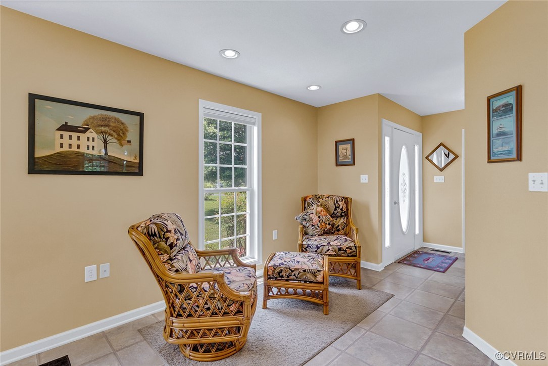 781 Coan Haven Road Lottsburg, VA 22511 - Photo 22 of 50 a living room with furniture and a large window