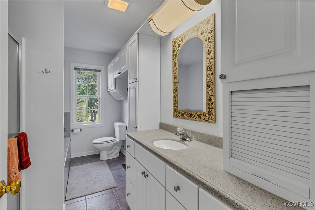 781 Coan Haven Road Lottsburg, VA 22511 - Photo 25 of 50 a bathroom with a granite countertop sink toilet and shower