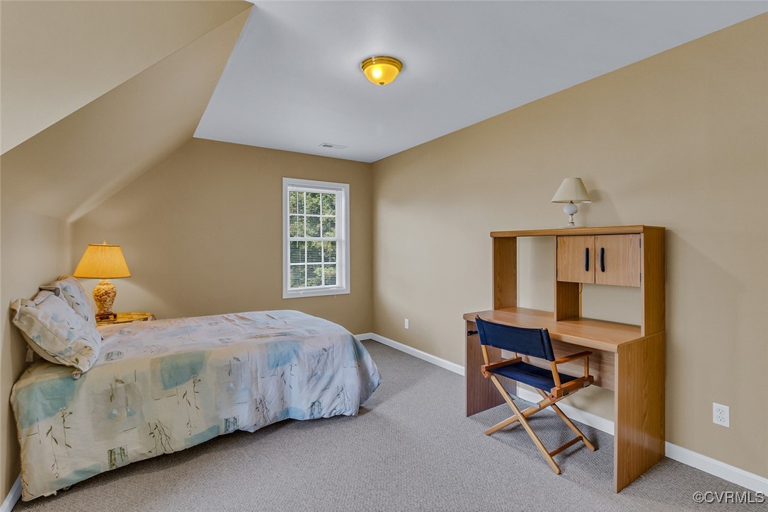 781 Coan Haven Road Lottsburg, VA 22511 - Photo 27 of 50 a bedroom with a bed and a window