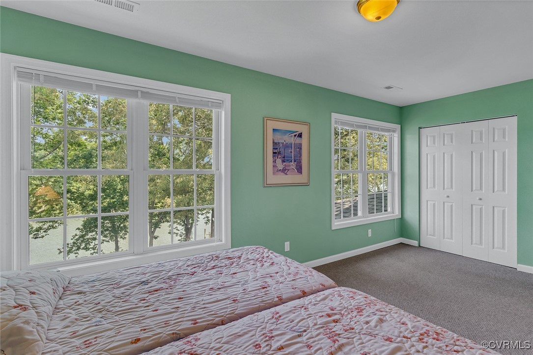 781 Coan Haven Road Lottsburg, VA 22511 - Photo 30 of 50 a bedroom with a bed and a window