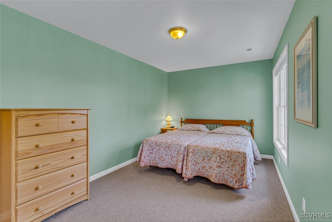 781 Coan Haven Road Lottsburg, VA 22511 - Photo 31 of 50 a bedroom with a bed and closet