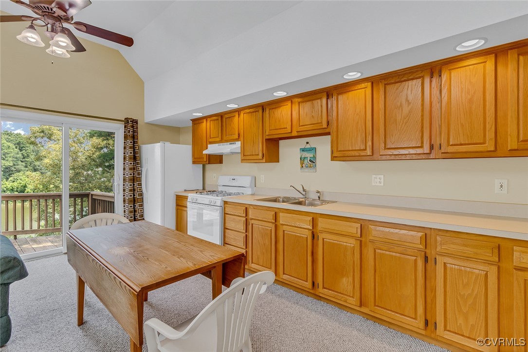 781 Coan Haven Road Lottsburg, VA 22511 - Photo 37 of 50 a kitchen with a sink a counter top space and stainless steel appliances