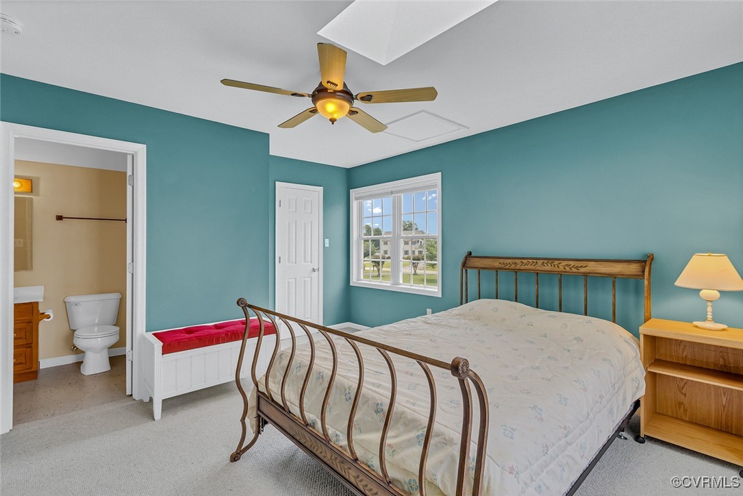 781 Coan Haven Road Lottsburg, VA 22511 - Photo 41 of 50 a bedroom with a bed and a chandelier