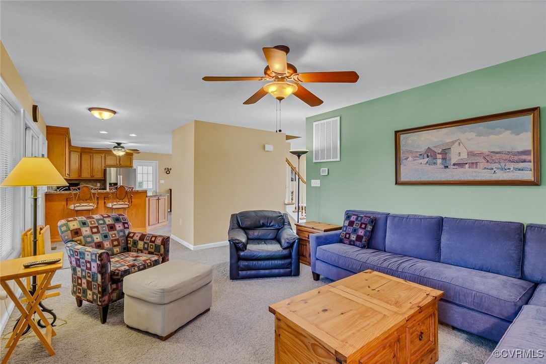781 Coan Haven Road Lottsburg, VA 22511 - Photo 10 of 50 a living room with furniture kitchen view and a chandelier