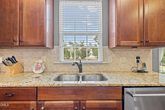 a living room with furniture and large windows