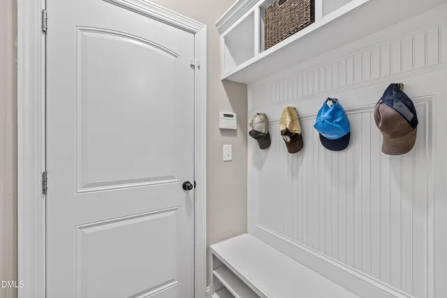 a bathroom with a double vanity sink mirror and shower