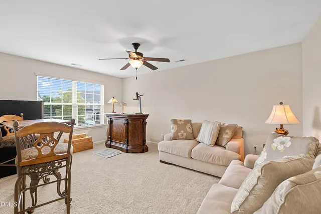 a view of walk in closet with clothes