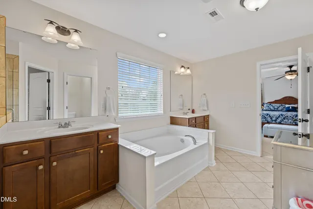 an aerial view of a house with a swimming pool outdoor seating and yard