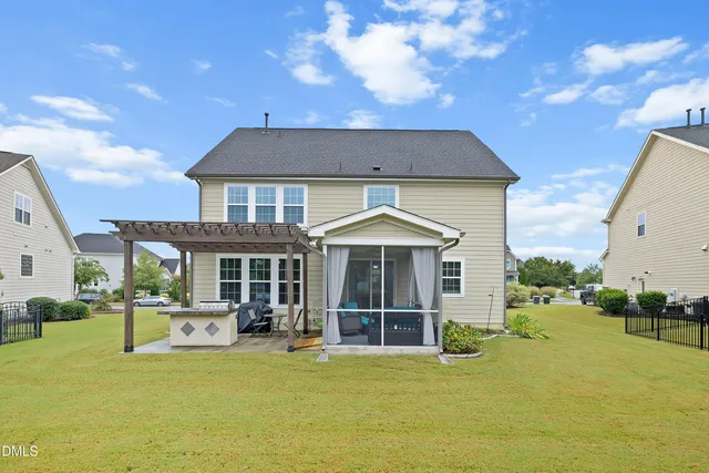 an aerial view of a houses with outdoor space and street view