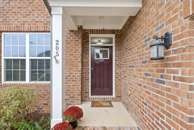 a view of dining room with furniture and wooden floor