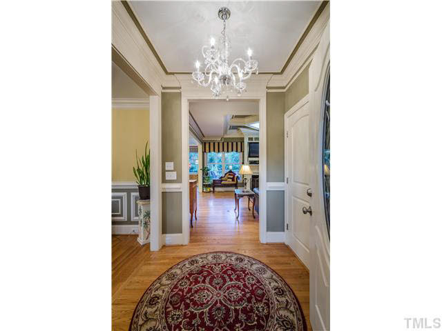 5120 Theys Road Raleigh, NC 27606 - Photo 3 of 25 This is the foyer that you want to greet your friends and family in! Custom lighting, hardwood floors and neutral paint welcome you into this wonderful home! Foyer