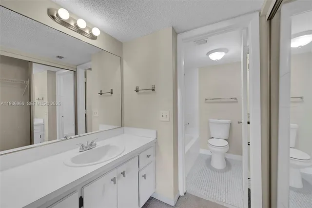 a bathroom with a toilet and bathtub
