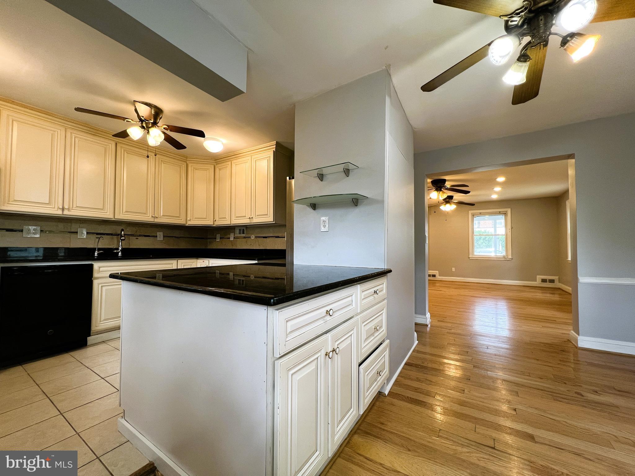 3705 Bancroft Road Baltimore, MD 21215 - Photo 14 of 50 a kitchen with stainless steel appliances granite countertop a sink and cabinets
