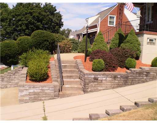 118 Leon Road Green Tree, PA 15220 - Photo 12 of 18 Exterior Front. Photo taken to show incline of driveway. Landscaping requires minimal care.
