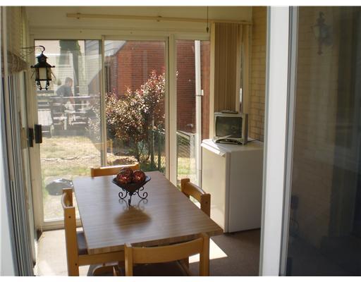 118 Leon Road Green Tree, PA 15220 - Photo 16 of 18 Patio/Deck. Enclosed summer room with sliding doors all around. Located off of the kitchen.