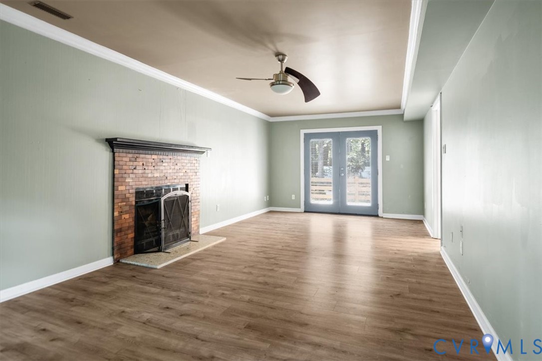 5902 Mill Spring Road Midlothian, VA 23112 - Photo 23 of 40 Main living area with ornamental molding, a brick