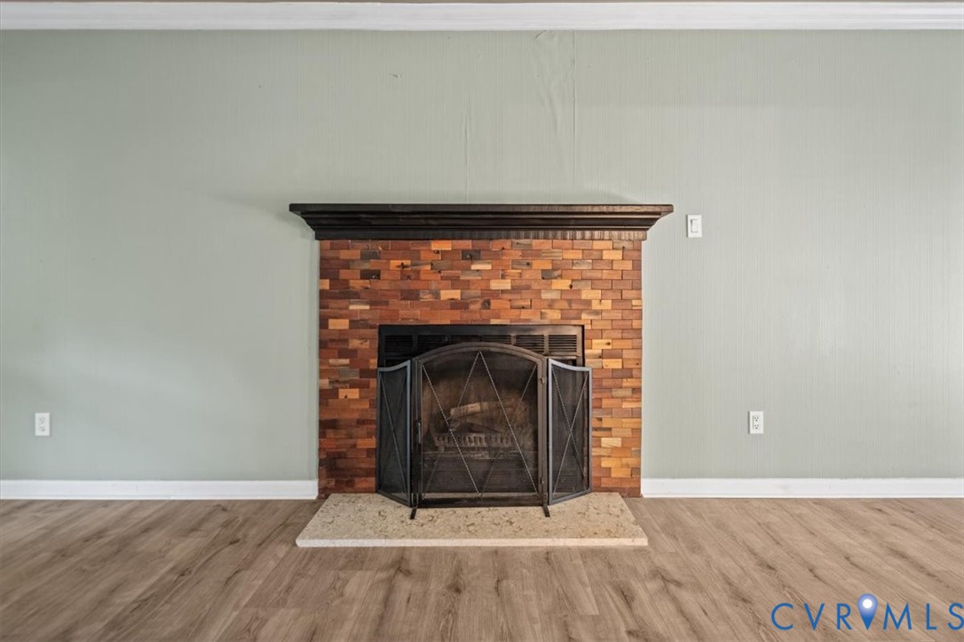 5902 Mill Spring Road Midlothian, VA 23112 - Photo 24 of 40 Detailed view of brick fireplace, wood finished fl