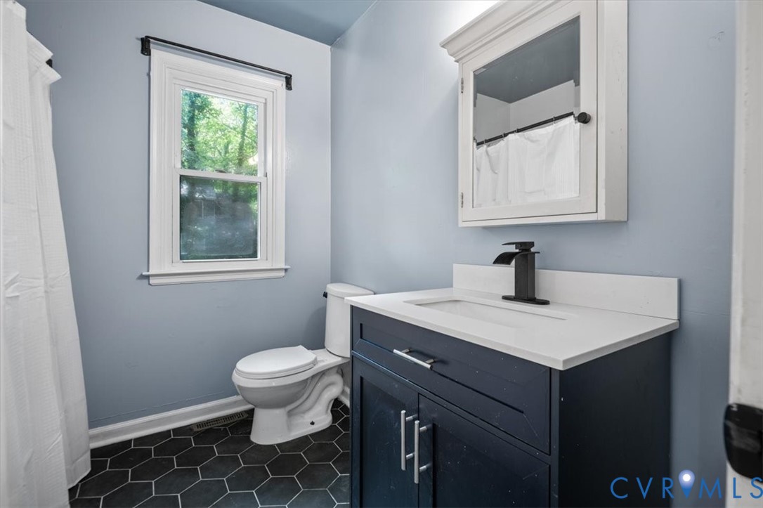 5902 Mill Spring Road Midlothian, VA 23112 - Photo 32 of 40 Bathroom with vanity and tile patterned floors