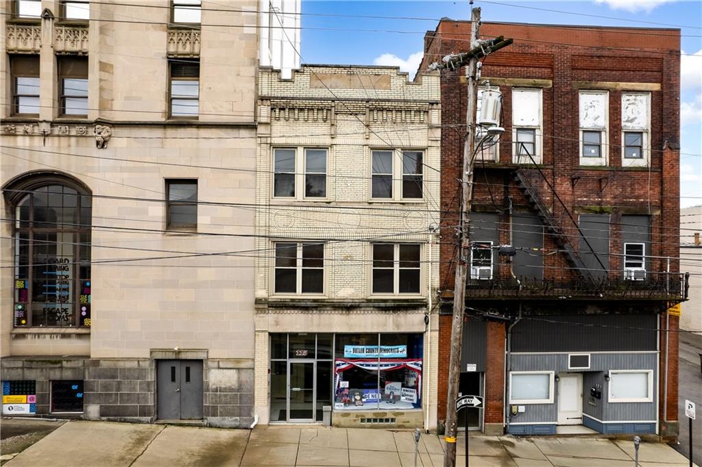 a front view of a building with glass windows