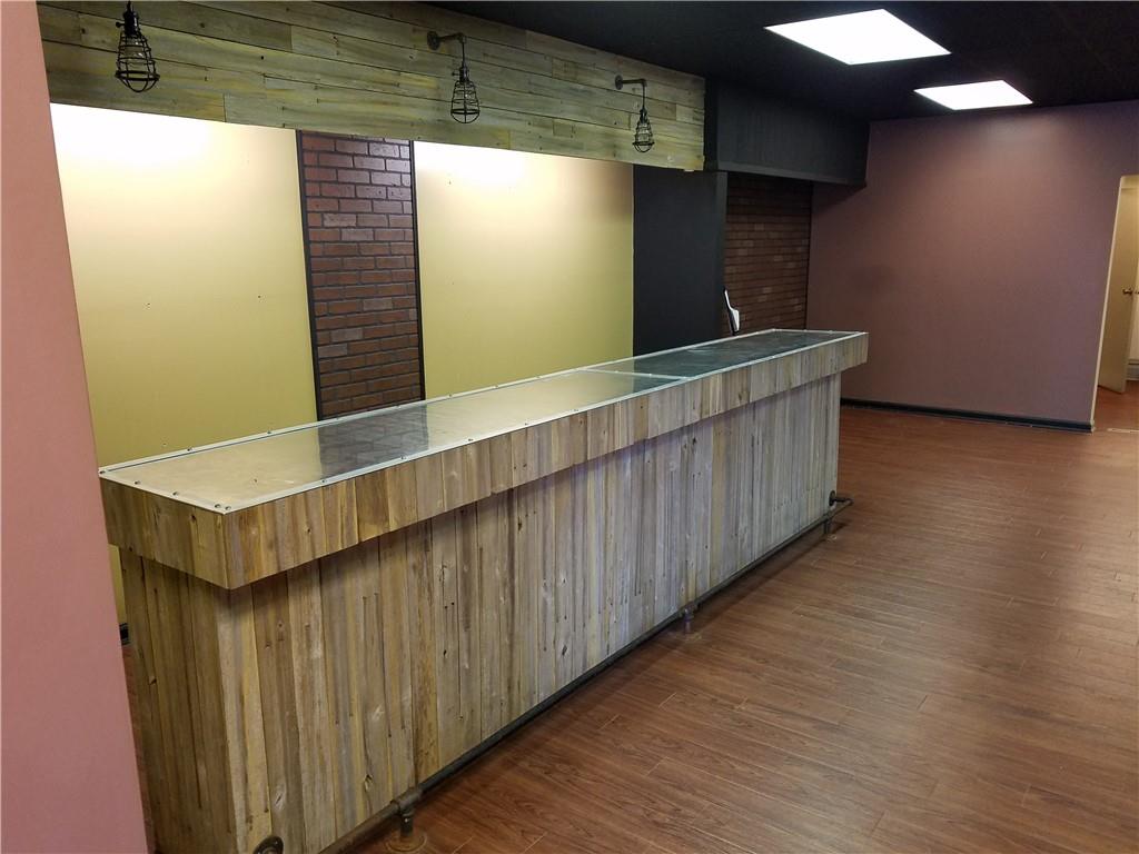 115 West Jefferson Street Butler, PA 16001 - Photo 11 of 30 a kitchen with cabinets and wooden floor