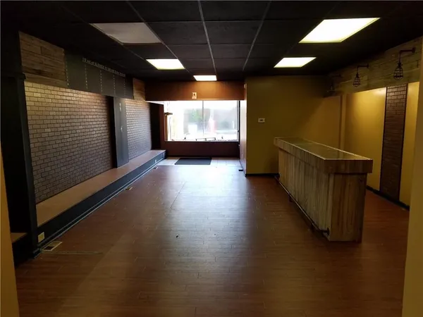 a view of a small space with wooden floor