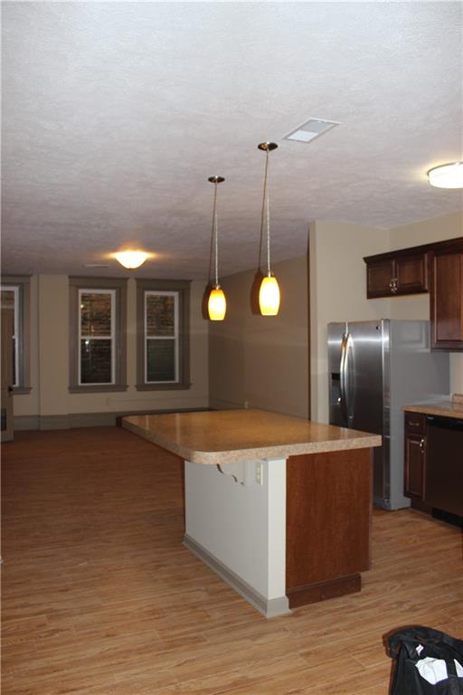 115 West Jefferson Street Butler, PA 16001 - Photo 21 of 30 a kitchen with stainless steel appliances granite countertop a sink a stove and a refrigerator
