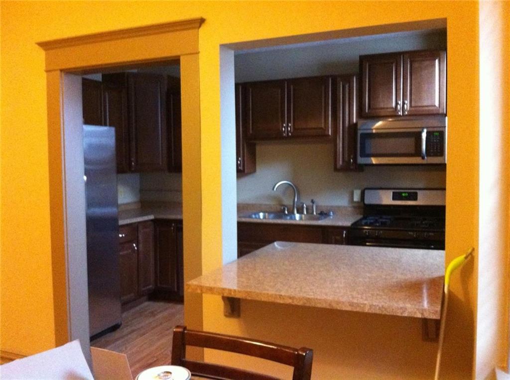 115 West Jefferson Street Butler, PA 16001 - Photo 29 of 30 a kitchen with a stove and a refrigerator